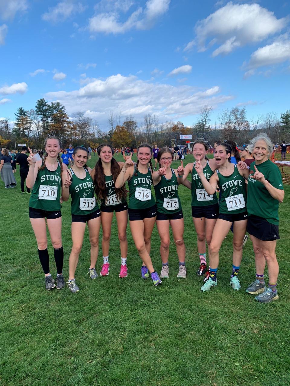 The Stowe girls pose after winning the D-III high school cross-country running state title at Thetford Academy on Saturday.