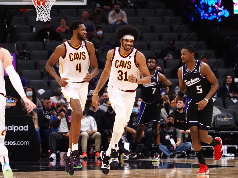 Jan 10, 2022; Sacramento, California, USA; Cleveland Cavaliers center Jarrett Allen (31) smiles with forward-center Evan Mobley (4) after scoring a basket against the Sacramento Kings during the fourth quarter at Golden 1 Center. Mandatory Credit: Kelley L Cox-USA TODAY Sports