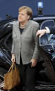 German Chancellor Angela Merkel arrives for an EU summit at the European Council building in Brussels, Friday, Feb. 21, 2020. In a second day of meetings EU leaders will continue to discuss the bloc's budget to work out Europe's spending plans for the next seven years. (Ludovic Marin, Pool Photo via AP)