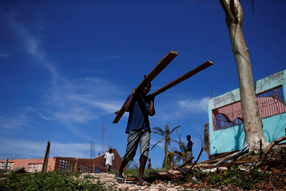 Workers rebuild a partially destroyed orphanage on Oct. 14, 2016.