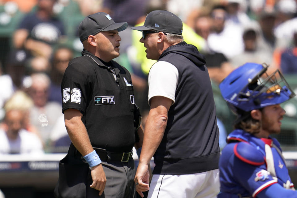 Detroit Tigers manager A.J. Hinch, right, argues with home plate umpire Jansen Visconti in the third inning of a baseball game against the Texas Rangers in Detroit, Sunday, June 19, 2022. (AP Photo/Paul Sancya)