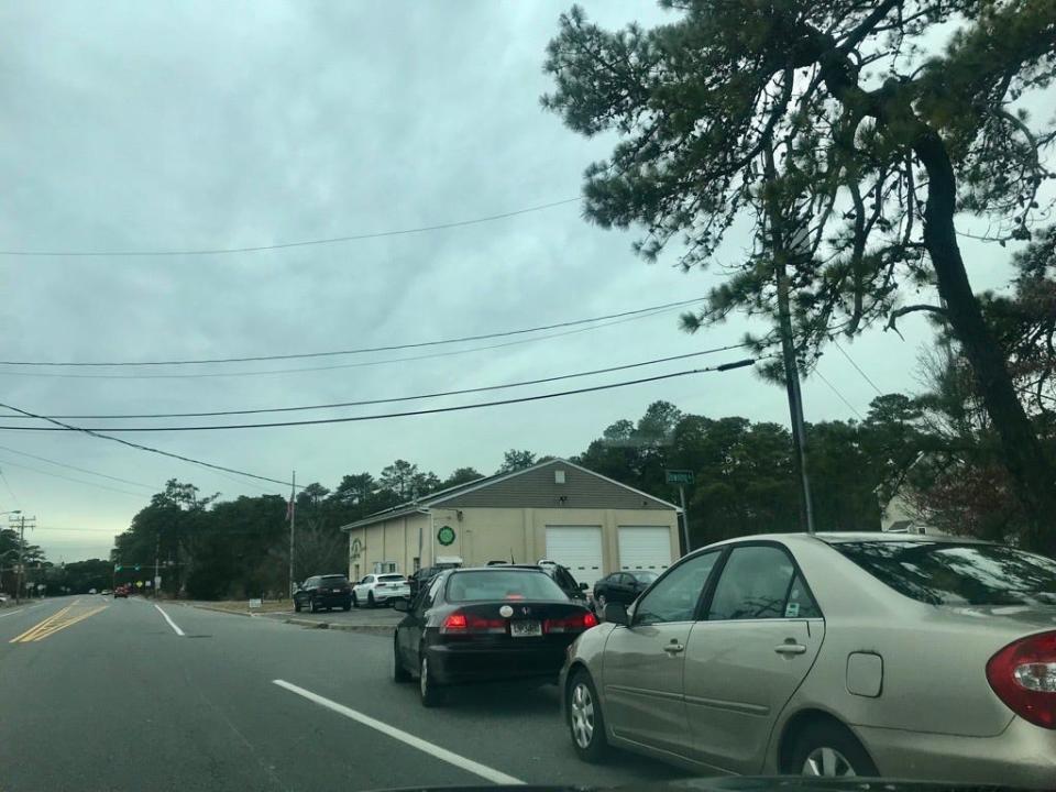 Motorists line up Monday for COVID-19 tests in Berkeley Township.