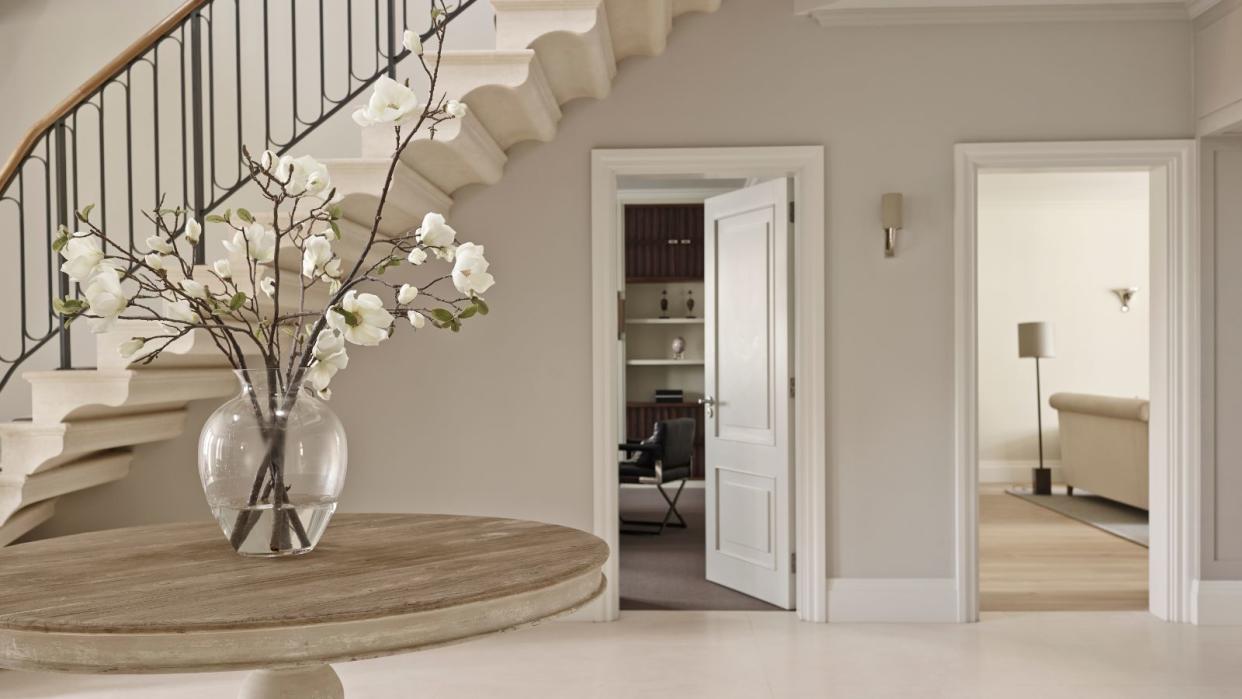  Hallway, grand entrance, round table, vase of flowers, tiled floor 