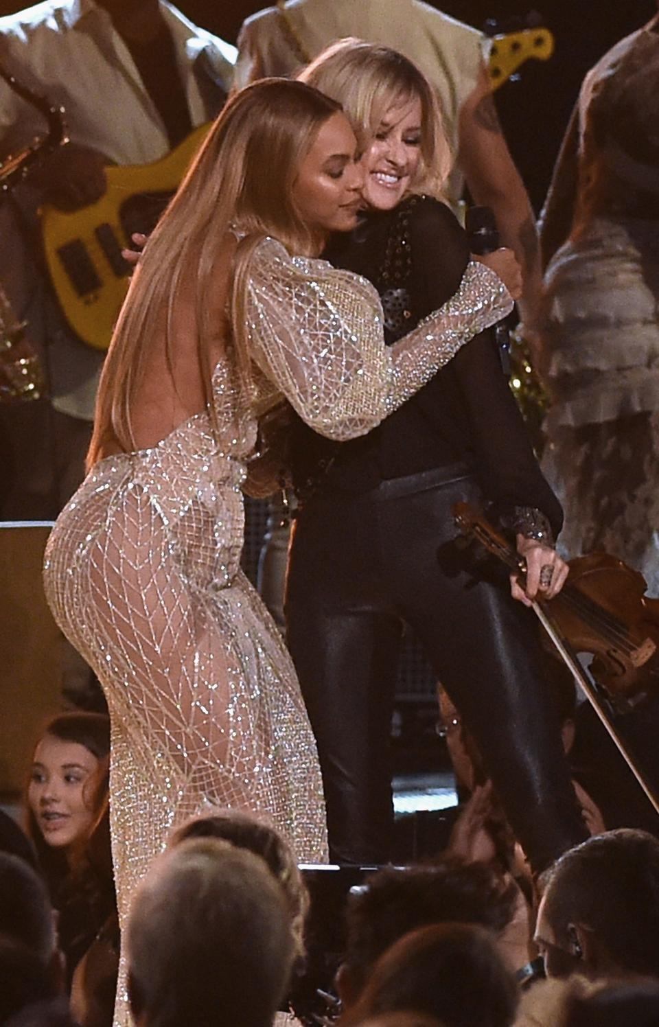 Beyonce performs onstage with Martie Maguire of the Dixie Chicks at the 50th annual CMA Awards at the Bridgestone Arena.