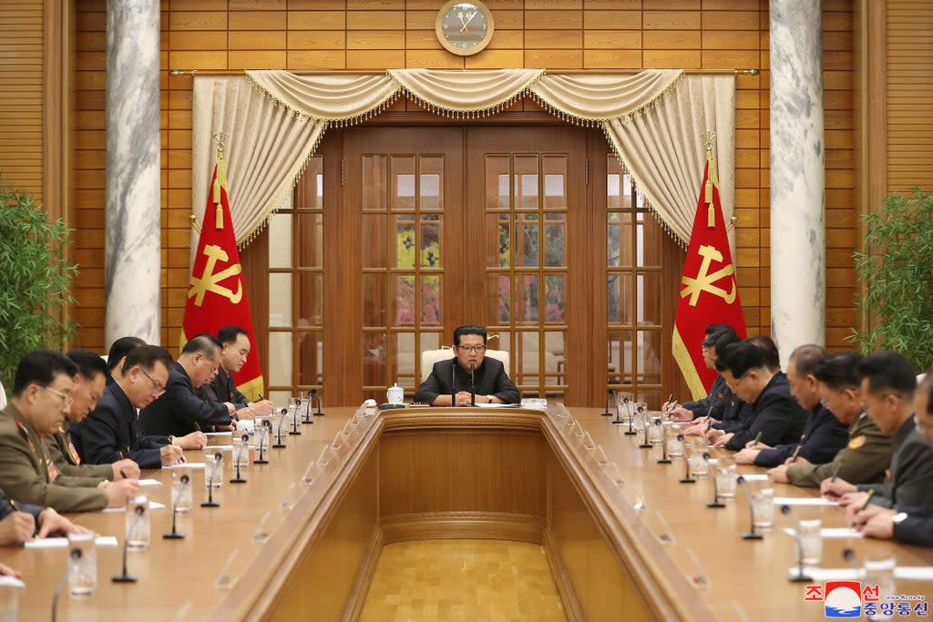 North Korean leader Kim Jong-un, centre, attends a meeting of the Workers’ Party of Korea in Pyongyang (AP)