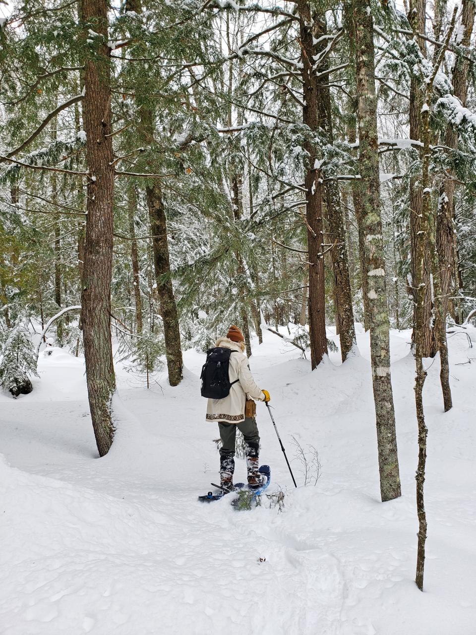 A snowshoer wears mukluks while trekking through deep powder in the Apostle Islands National Lakeshore on the Bayfield peninsula.