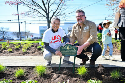 Chris Jung, left, President and CEO of LG Electronics North America, and naturalist Dave Mizejewski, of the National Wildlife Federation, unveil the new pollinator garden at Life's Good Earth Day Community Fair, Monday, April 22, 2024, at the LG Electronics North American Innovation Campus in Englewood Cliffs, NJ.  Earning a Certified Wildlife Habitat® certification through the NWF, LG's garden is outfitted with native plants, designed to attract a mixture of pollinators, such as bees, butterflies, moths, and beetles, which will encourage biodiversity, plant growth, clean air, and support wildlife. (Diane Bondareff/AP Images for LG Electronics)