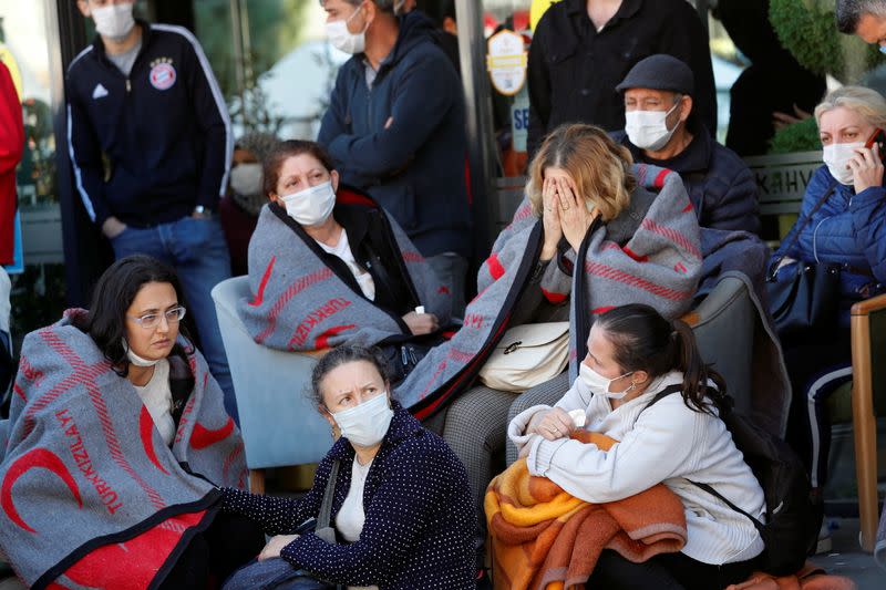 Rescue workers search for earthquake survivors in Izmir