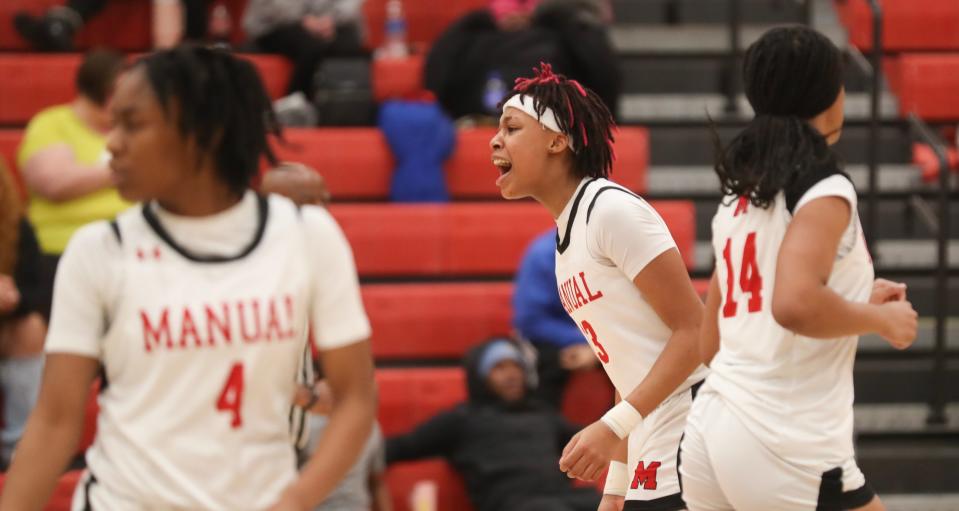 Manual’s Ashlinn James celebrates after making a basket against Central in the 25th District final Thursday night.