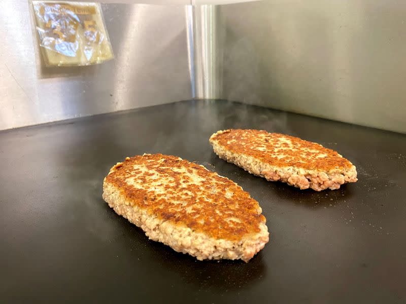 FILE PHOTO: Employees work at the Impossible Foods headquarters in Silicon Valley, in San Francisco, California