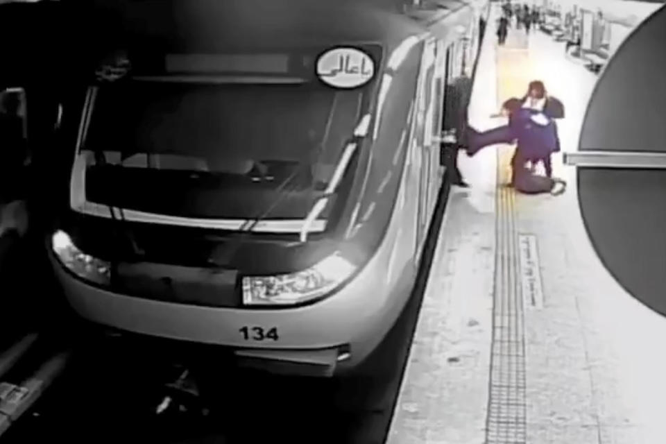 In this image from surveillance video aired by Iranian state television, women pull 16-year-old Armita Geravand from a train car on the Tehran Metro in Tehran, Iran, Oct. 1, 2023. / Credit: AP Photo/Iranian state television