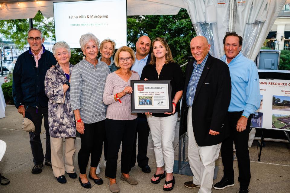 Members of the Claremont House Team from Glastonbury Abbey accept the Richard C. and Virginia A. Welch Dedicated Volunteer Award at the Father Bill's and MainSpring Supporter Reception on Tuesday, Sept. 27.