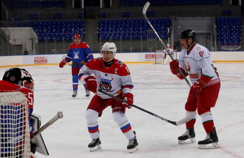 FILE PHOTO: Russian President Vladimir Putin plays ice hockey