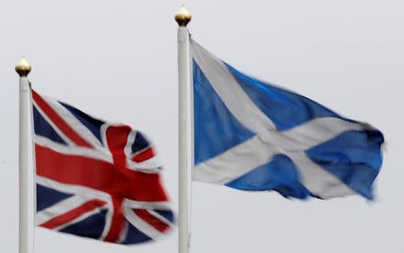 The Union flag and Saltire are seen flying side by side at Bankfoot in Perthshire ,Scotland January 10, 2012. REUTERS/Russell Cheyne