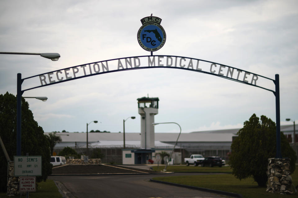 FILE - A guard tower stands behind the entrance to the Reception and Medical Center, the state's prison hospital where new inmates are processed, in Lake Butler, Fla., Friday, April 16, 2021. According to public documents and interviews with a dozen inmates and current and former employees in the nation’s tenth largest prison system, Florida prison guards openly tout associations with white supremacist groups to intimidate inmates and Black colleagues, a persistent practice that goes unpunished and is allowed to fester in prisons throughout the U.S. (AP Photo/David Goldman, File)