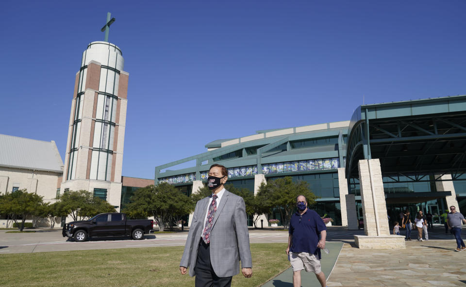 Members of Prestonwood Baptist Church walk from the church after morning services Sunday, Oct. 11, 2020, in Plano, Texas. Three weeks before the U.S. presidential election, an evangelical church in a Dallas suburb has emerged as a front for Republicans fighting to keep the diversifying state from flipping to Democratic presidential candidate Joe Biden. (AP Photo/LM Otero)