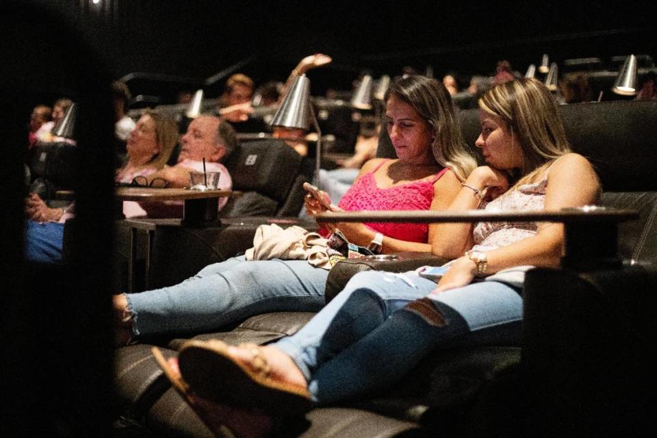 Vanessa Collado, 39, and daughter-in-law Emily Leal, 21, wait for the Barbie movie to start at Cinépolis Coconut Grove in Miami, Fla., on Sunday, July 23, 2023. Leal had a Barbie themed 21st birthday party a few weeks ago.