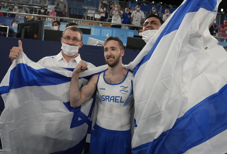 Artem Dolgopyat of Israel, celebrates after winning the gold medal on the floor exercise during the artistic gymnastics men's apparatus final at the 2020 Summer Olympics, Sunday, Aug. 1, 2021, in Tokyo. (AP Photo/Natacha Pisarenko)