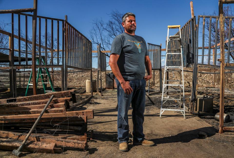 Ranch owner Guillermo Figueroa poses for a photo in front a burned down horse stable on his property in Hemet, Calif., Tuesday, Sept. 27, 2022. His familyÕs ranch was severely damaged by the Fairview FireÊearlier in the month.ÊWhile homes on the property were able to be saved, Figueroa lost three of his horses, five adult dogs, 16 month-old puppies and many chickens as well as horse stalls, chicken coops, tractors and much more. 