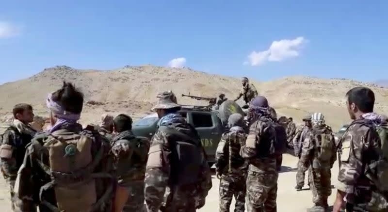 Truck with National Resistance Front markings is seen on a mountain top near Panjshir Valley