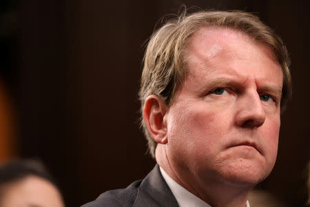 FILE PHOTO: White House Counsel Don McGahn listens during the confirmation hearing for U.S. Supreme Court nominee judge Brett Kavanaugh on Capitol Hill in Washington, U.S., September 4, 2018. REUTERS/Chris Wattie/File Photo