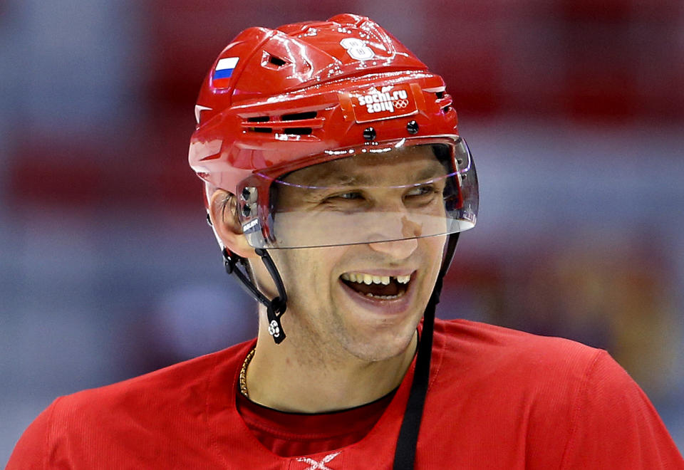 Russia forward Alexander Ovechkin laughs with teammates during a training session at the 2014 Winter Olympics, Monday, Feb. 10, 2014, in Sochi, Russia. (AP Photo/Julie Jacobson)