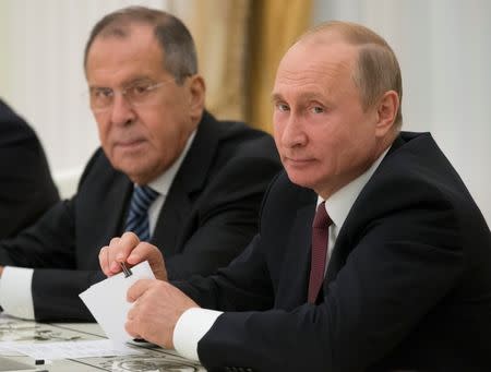 Russia's President Vladimir Putin (R) and Foreign Minister Sergei Lavrov attend a meeting with U.S. National Security Adviser John Bolton at the Kremlin in Moscow, Russia June 27, 2018. Alexander Zemlianichenko/Pool via REUTERS