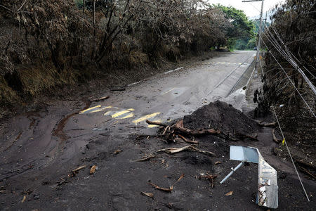 A road affected by a lahar from Fuego volcano is seen in El Rodeo, Guatemala June 13, 2018. REUTERS/Jose Cabezas