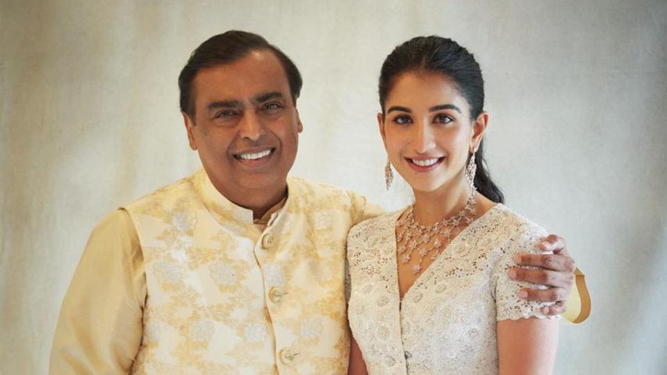Radhika posing with Anant's father Mukesh Ambani