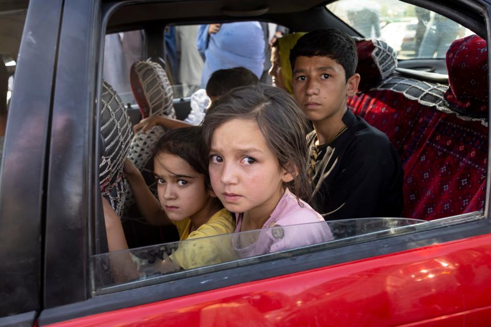 Afghan families head into Kabul from the northern provinces desperately leaving their homes behind on Aug. 10, 2021.