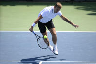 Daniel Evans, of England, lunges for the ball during a match against Brandon Nakashima in the Citi Open tennis tournament, Wednesday, Aug. 4, 2021, in Washington. (AP Photo/Nick Wass)