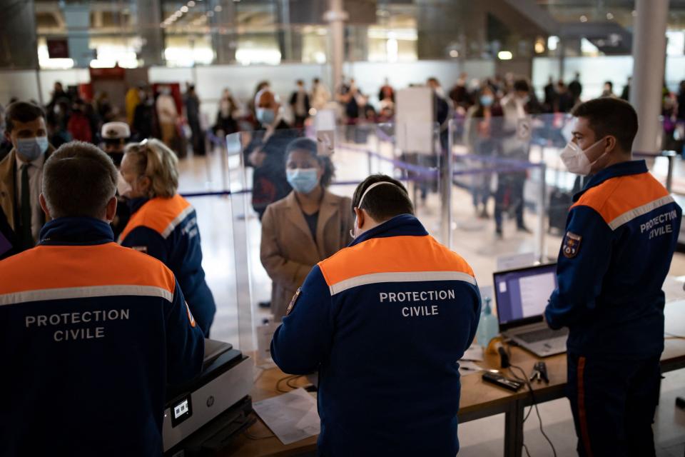 Passengers arriving from countries listed as Covid-19 red zones register for coronavirus tests upon their arrival at Roissy Charles de Gaulle airport in Roissy, near Paris, on April 25, 2021. - Passengers arriving in France from Brazil, Chile, Argentina, South Africa, India and Guyana must submit to a Covid-19 antigenic test and follow a 10 day quarantine at home, to curb the spread of coronavirus variants. (Photo by Ian LANGSDON / POOL / AFP) (Photo by IAN LANGSDON/POOL/AFP via Getty Images)