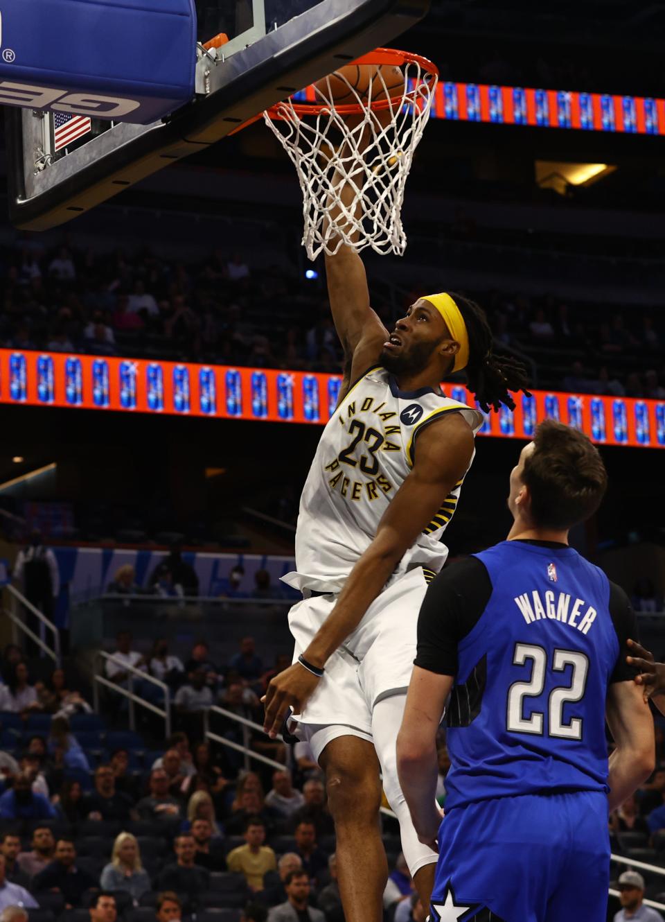 Mar 2, 2022; Orlando, Florida, USA; Indiana Pacers forward Isaiah Jackson (23) dunks the ball past Orlando Magic forward Franz Wagner (22) during the second quarter at Amway Center.