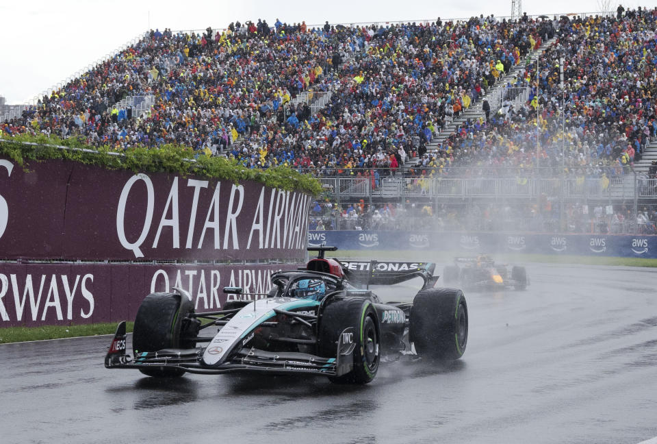 Mercedes driver George Russell, of the United Kingdom, leads Red Bull Racing driver Max Verstappen, of the Netherlands, through the Senna corner at the Canadian Grand Prix in Montreal, Sunday, June 9, 2024. (Christinne Muschi/The Canadian Press via AP)