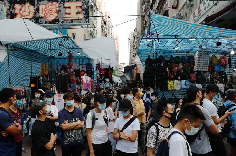 People gather during a demonstration oppose postponed elections, in Hong Kong