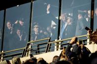 President-elect Donald Trump waves from the Army side during an Army-Navy NCAA college football game at M&T Bank Stadium, Saturday, Dec. 10, 2016, in Baltimore. (AP Photo/Andrew Harnik)