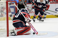 Washington Capitals goaltender Ilya Samsonov (30) stops the puck during the second period of an NHL hockey game against the Columbus Blue Jackets, Saturday, Dec. 4, 2021, in Washington. (AP Photo/Nick Wass)