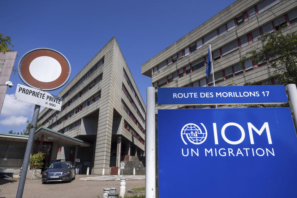 The logo and a view of the building which houses the headquarters of the International Organization for Migration (IOM) in Geneva, Switzerland, Thursday, July 11, 2024. Amy Pope, Director-General of the IOM, said Thursday it has taken in billions in new funding and diversified its donor base at a time when other U.N. groups have struggled to get needed money. Elections worldwide, however, are raising questions about future support, she said. (Martial Trezzini/Keystone via AP)