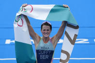 Flora Duffy of Bermuda celebrates after crossing the finish line to win the gold medal in the women's individual triathlon competition at the 2020 Summer Olympics, Tuesday, July 27, 2021, in Tokyo, Japan. (AP Photo/David Goldman)