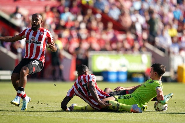 Harry Maguire, right, fouls Brentford's Ivan Toney