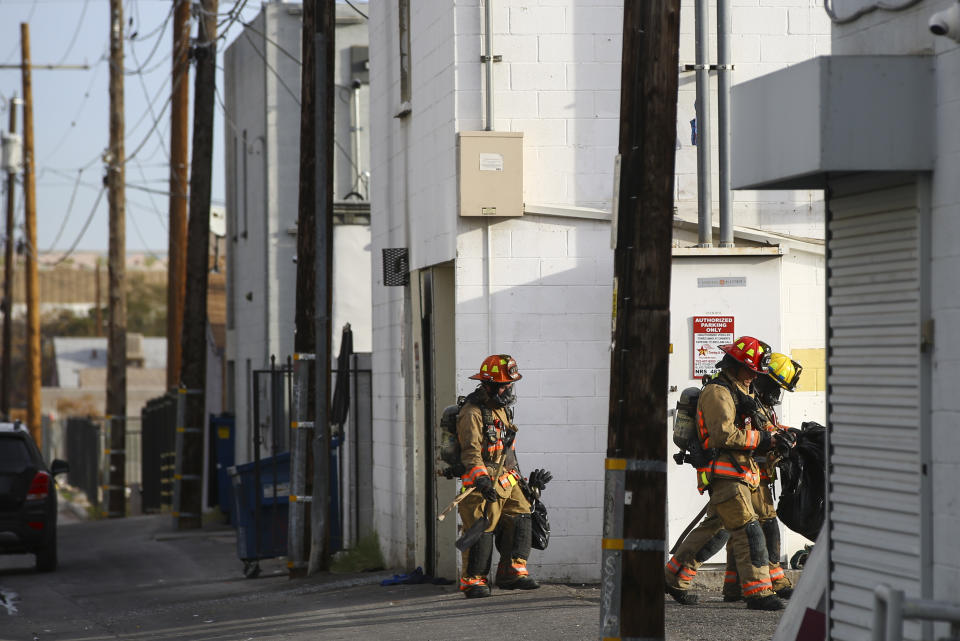 Las Vegas firefighters work the scene of a fire at a three-story apartment complex early Saturday, Dec. 21, 2019 in Las Vegas. The fire was in first-floor unit of the Alpine Motel Apartments and its cause was under investigation, the department said. Authorities say multiple fatalities were reported and several were injured. (Chase Stevens /Las Vegas Review-Journal via AP)