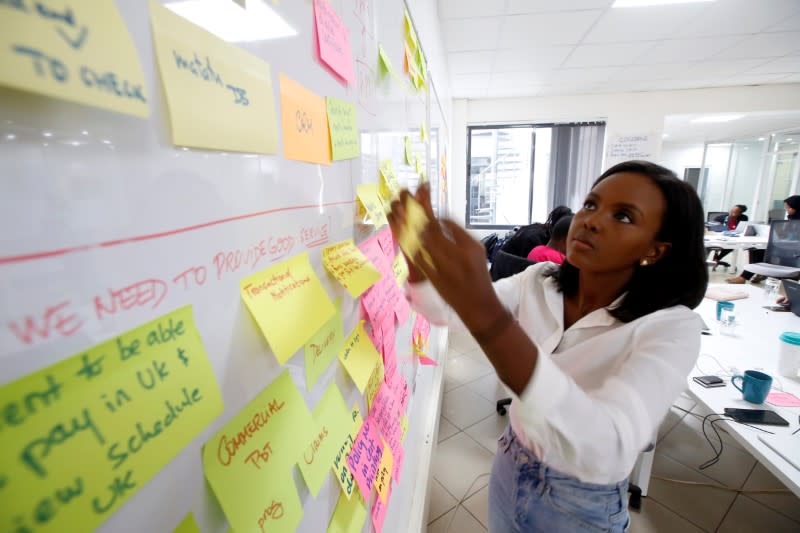Jihan Abass, founder and CEO of Griffin Insurance, arranges notes as they prepare to release their flagship digital-only car insurance company, in Nairobi