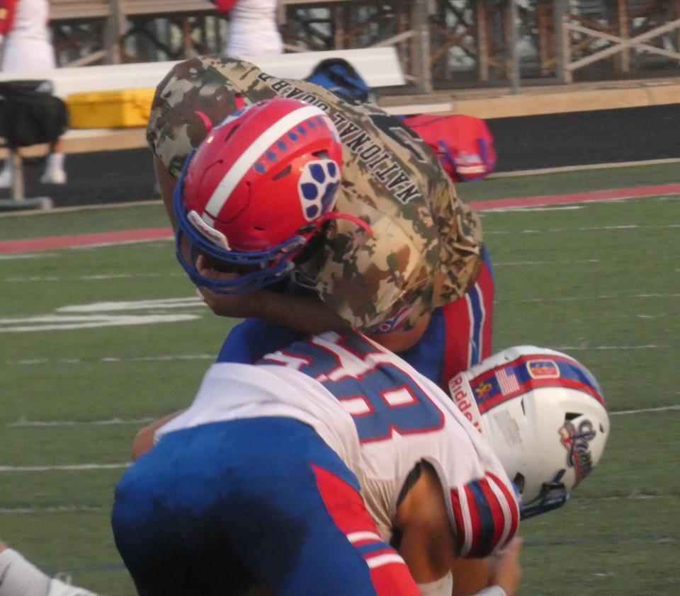 Lakewood senior Cohen Rine tackles Licking Valley senior Colton Carr during last Friday's game. Rine plays offensive line and linebacker and also kicks off for the Lancers.