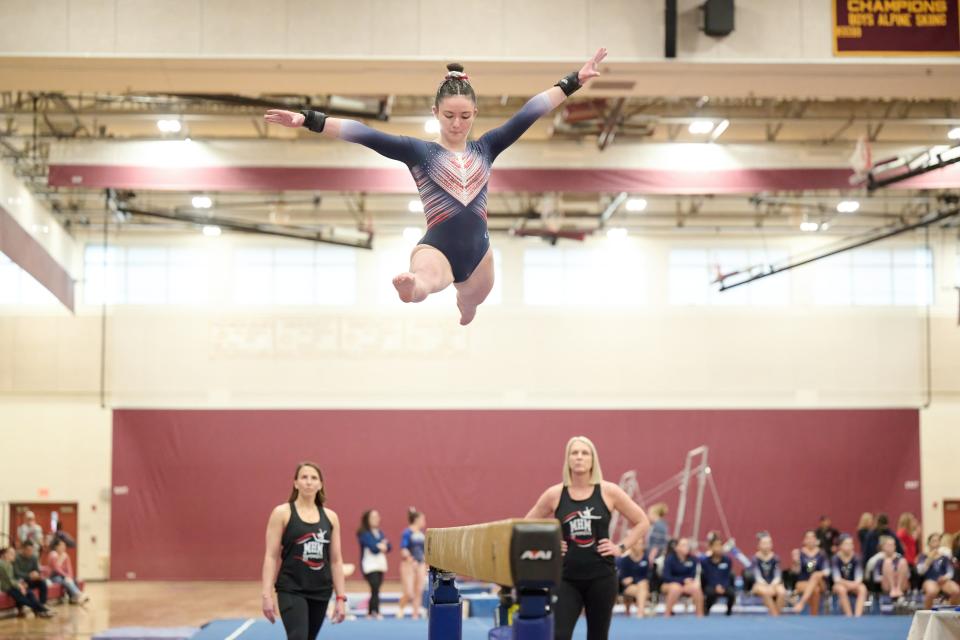 Milford senior Caleigh Wilson competes on the balance beam for the MMHM co-op program. She joined the team the same year Milford was added to the co=op.
