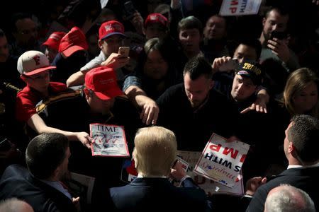 U.S. Republican presidential candidate Donald Trump greets supporters at the Peabody Opera House in St. Louis, Missouri, March 11, 2016. REUTERS/Aaron P. Bernstein