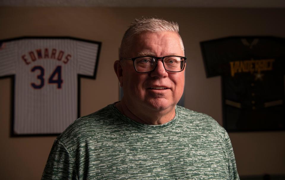Jeff Edwards, stands in front of two of his old baseball jerseys at his home in Mt. Juliet, Tenn., Thursday, March 28, 2024.