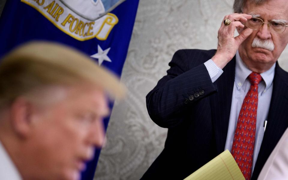 Donald Trump and John Bolton, his former national security adviser -  BRENDAN SMIALOWSKI/AFP via Getty Images