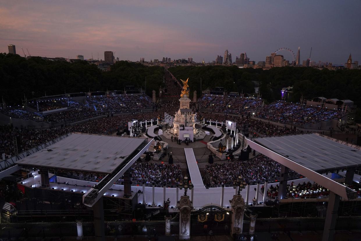 Crowds watch the Platinum Jubilee concert in front of Buckingham Palace in London on Saturday, June 4, 2022, on the third of four days of celebrations to mark the Platinum Jubilee.