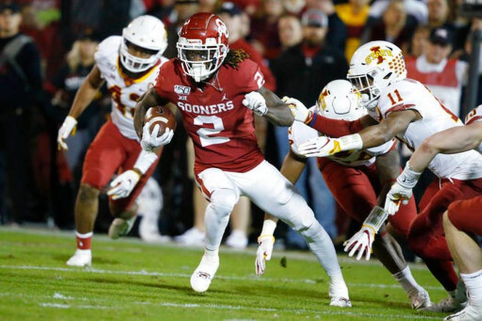 FILE - In this Nov. 9, 2019, file photo, Oklahoma wide receiver CeeDee Lamb (2) carries during the team’s NCAA college football game against Iowa State in Norman, Okla. The Raiders have the 12th and 19th picks in the NFL draft thanks to the 2018 trade that sent star pass rusher Khalil Mack to the Chicago Bears. Several receivers are projected to go in the first round. Alabama’s Jerry Jeudy and Henry Ruggs and Oklahoma’s Lamb are considered by many analysts to be the best of the bunch.