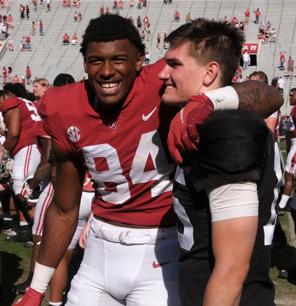 Apr 22, 2023; Tuscaloosa, AL, USA;  Crimson team tight end Amari Niblack (84) and Crimson team quarterback Ty Simpson (15) embrace after the Crimson victory over White during the A-Day game at Bryant-Denny Stadium. 